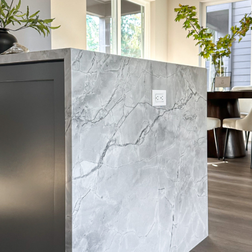 Modern kitchen featuring a sleek quartz countertop with clean lines
