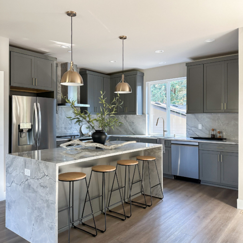 Modern kitchen featuring a sleek quartz countertop with clean lines