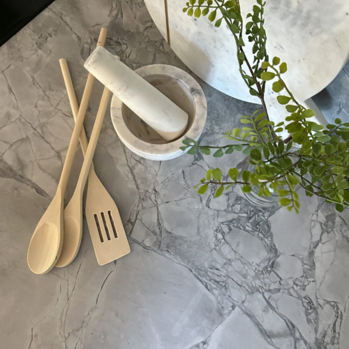 Modern kitchen featuring a sleek quartz countertop with clean lines