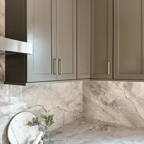 Modern kitchen featuring a sleek quartz countertop with clean lines