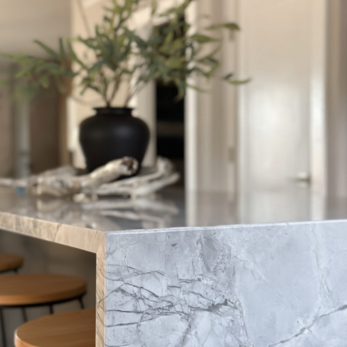 Modern kitchen featuring a sleek quartz countertop with clean lines