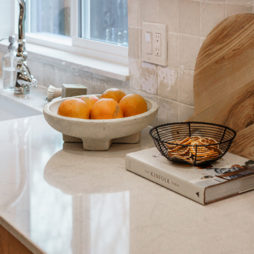 Modern kitchen featuring a sleek quartz countertop with clean lines