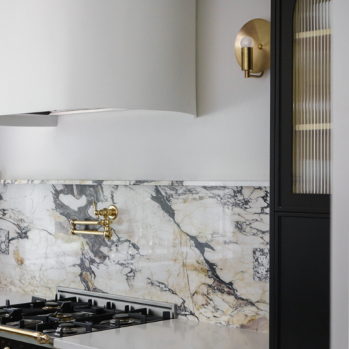 Modern kitchen featuring a sleek quartz countertop with clean lines