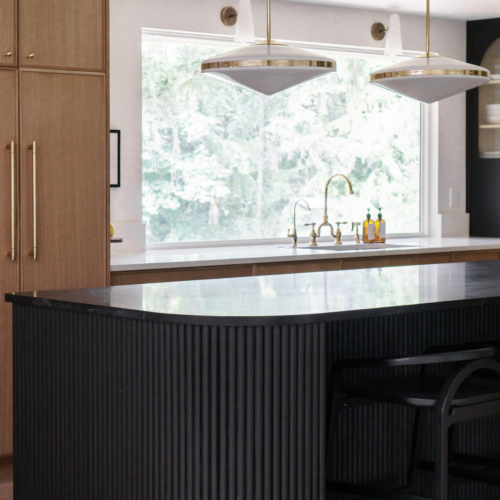 Modern kitchen featuring a sleek quartz countertop with clean lines