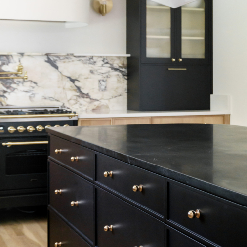 Modern kitchen featuring a sleek quartz countertop with clean lines