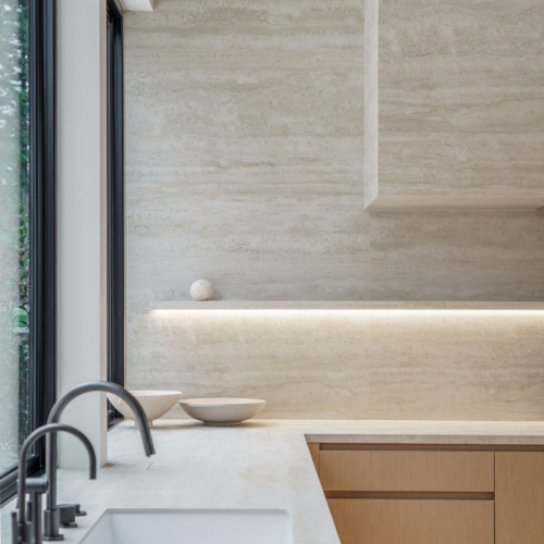 Modern kitchen featuring a sleek quartz countertop with clean lines