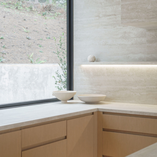 Modern kitchen featuring a sleek quartz countertop with clean lines