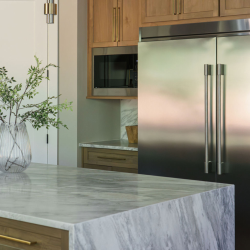 Modern kitchen featuring a sleek quartz countertop with clean lines