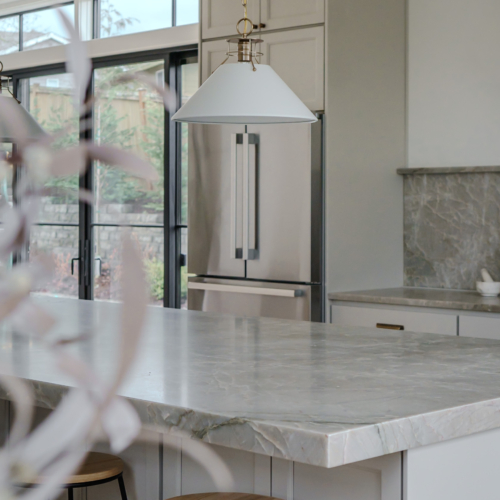 Modern kitchen featuring a sleek quartz countertop with clean lines