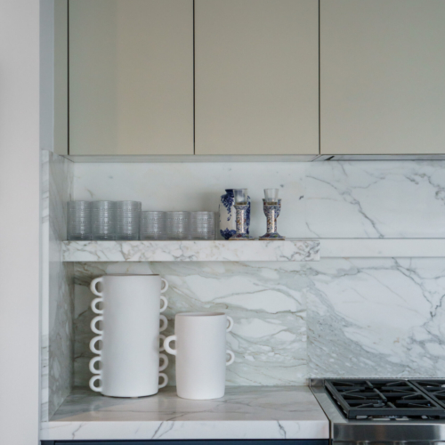 Modern kitchen featuring a sleek quartz countertop with clean lines