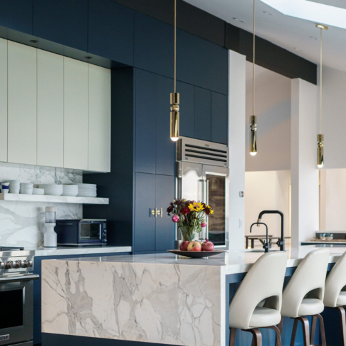 Modern kitchen featuring a sleek quartz countertop with clean lines
