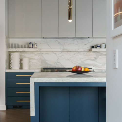 Modern kitchen featuring a sleek quartz countertop with clean lines