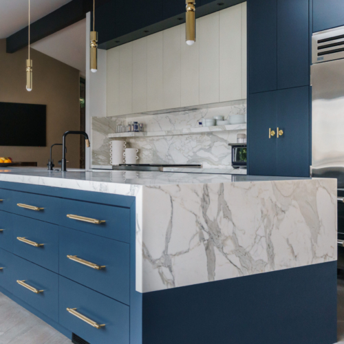 Modern kitchen featuring a sleek quartz countertop with clean lines