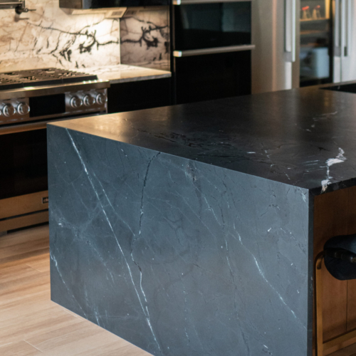 Modern kitchen featuring a sleek quartz countertop with clean lines