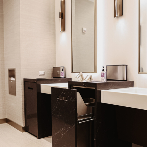 cambria-brittanicca-gold-delta-sky-lounge-104-rest-room-sink-progranite-restroom