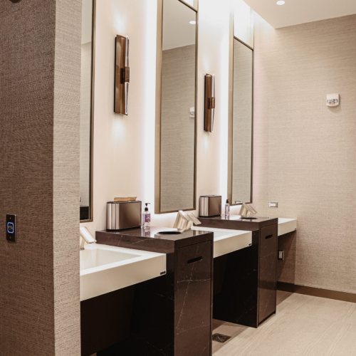 cambria-brittanicca-gold-delta-sky-lounge-111-rest-room-sink-progranite-countertop-modern-commercial-restroom