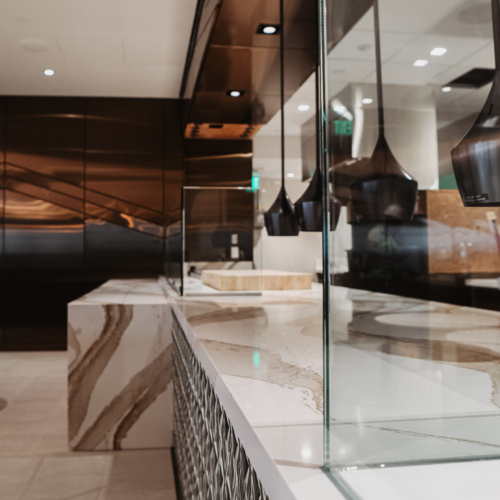 cambria-brittanicca-gold-delta-sky-lounge-36-progranite-designer-waterfall