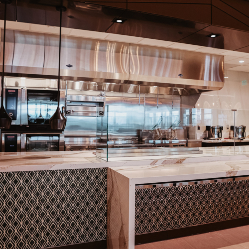 cambria-brittanicca-gold-delta-sky-lounge-45-water-fall-progranite-designer-seattle-waterfall