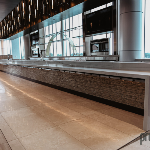 cambria-brittanicca-gold-delta-sky-lounge-95-water-fall-modern-elegant