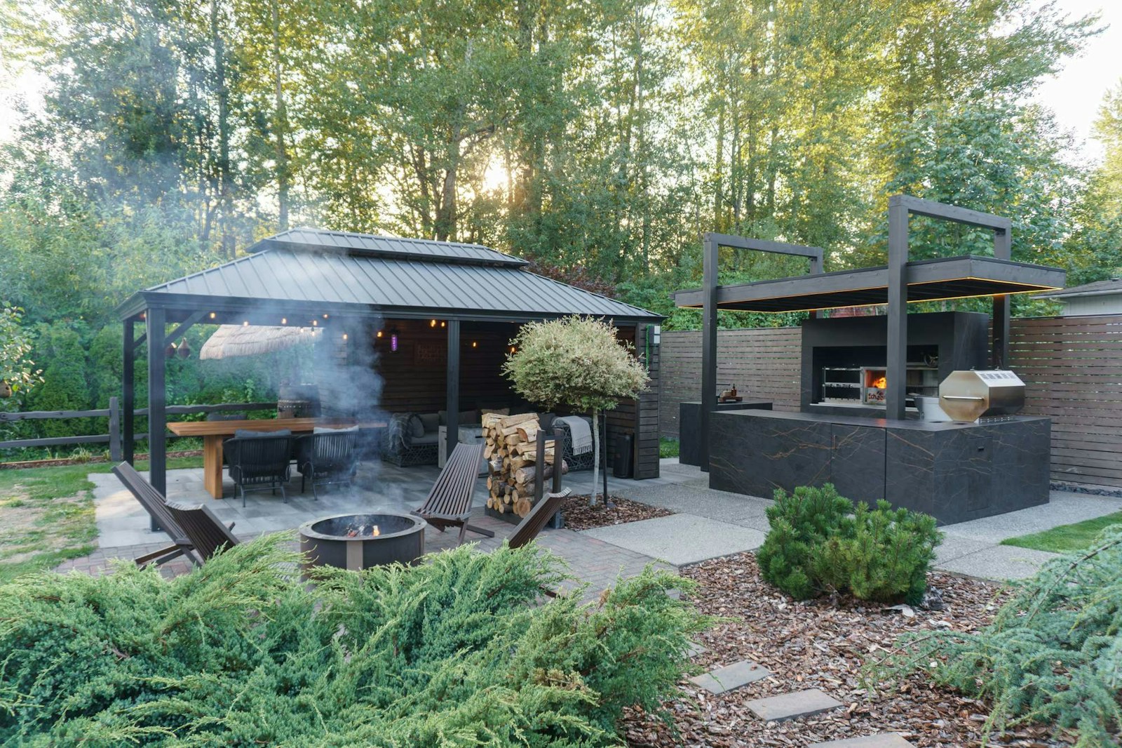 Brazilian churrasquera-style charcoal grill set into a Dekton outdoor kitchen