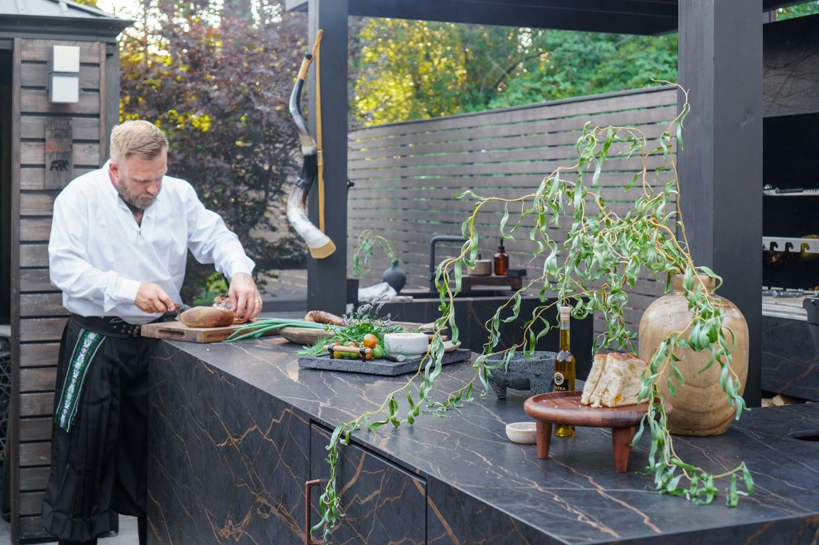 Dekton Laurent countertop and BBQ cladding detail in Everett outdoor kitchen